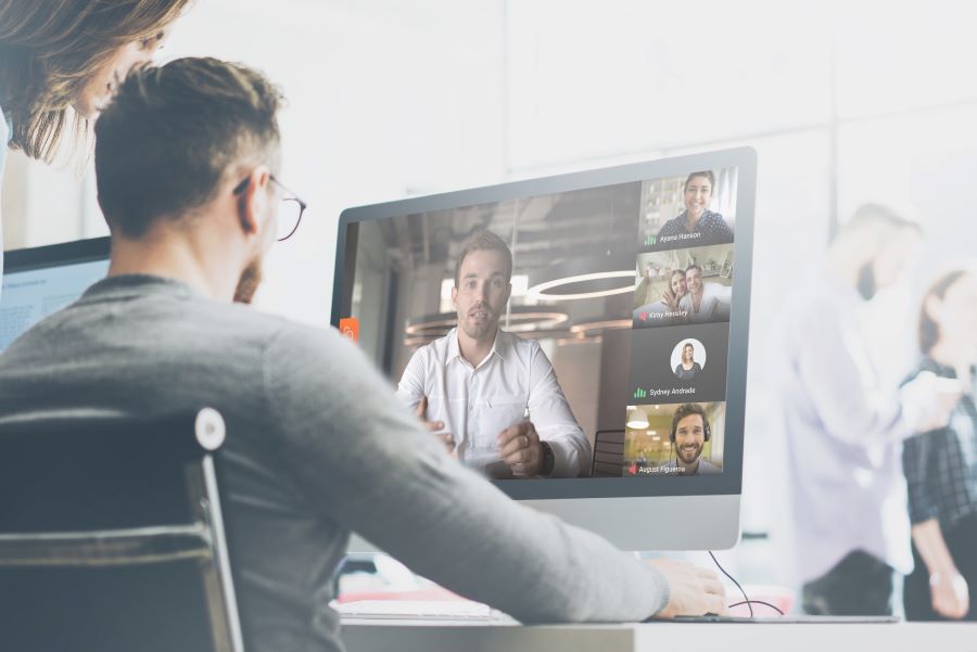 man at desk on video call